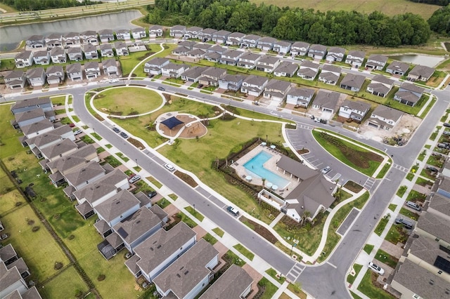 4077 Cadence Loop, Land O Lakes, FL 34638 - aerial view of property's location with a nearby body of water, nearby suburban area, and a pool area
