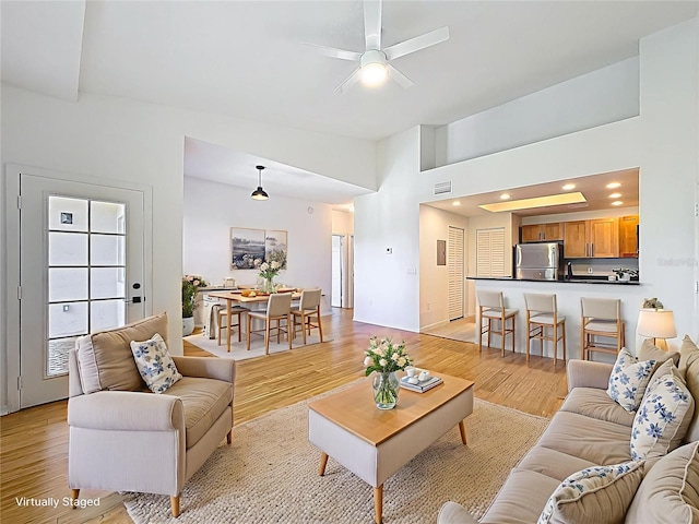 2015 SE 10th Ave Unit 123, Fort Lauderdale, FL 33316 - living room featuring light wood-type flooring, a ceiling fan, and recessed lighting