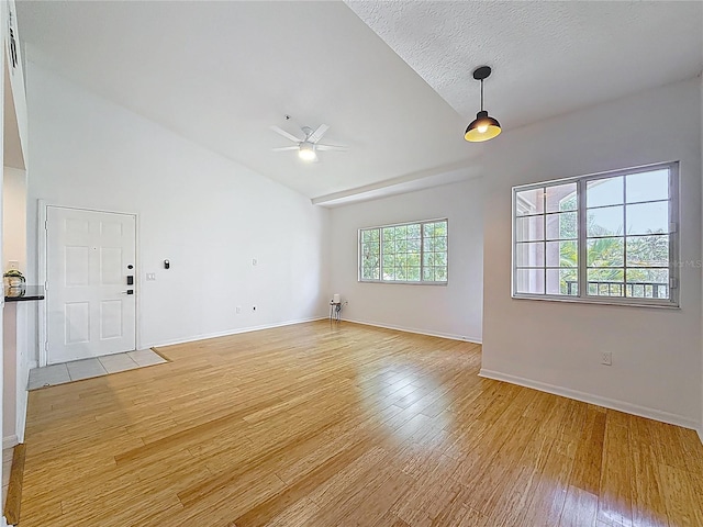 2015 SE 10th Ave Unit 123, Fort Lauderdale, FL 33316 - empty room with light wood finished floors, ceiling fan, and high vaulted ceiling