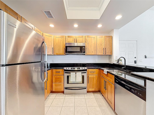 2015 SE 10th Ave Unit 123, Fort Lauderdale, FL 33316 - kitchen with appliances with stainless steel finishes, dark countertops, light tile patterned floors, recessed lighting, and crown molding