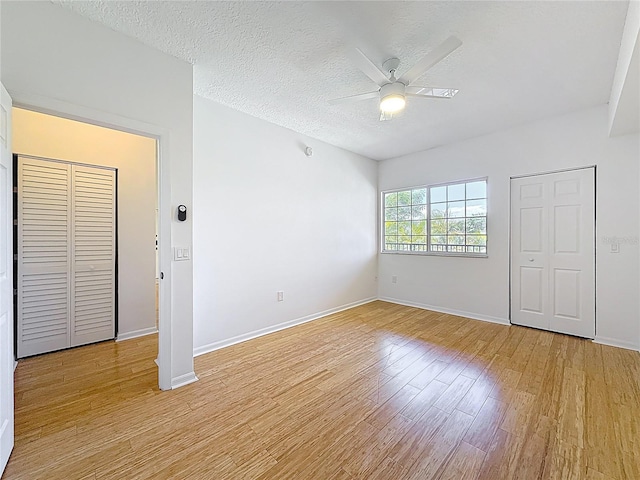 2015 SE 10th Ave Unit 123, Fort Lauderdale, FL 33316 - spare room featuring ceiling fan, light wood-type flooring, and a textured ceiling