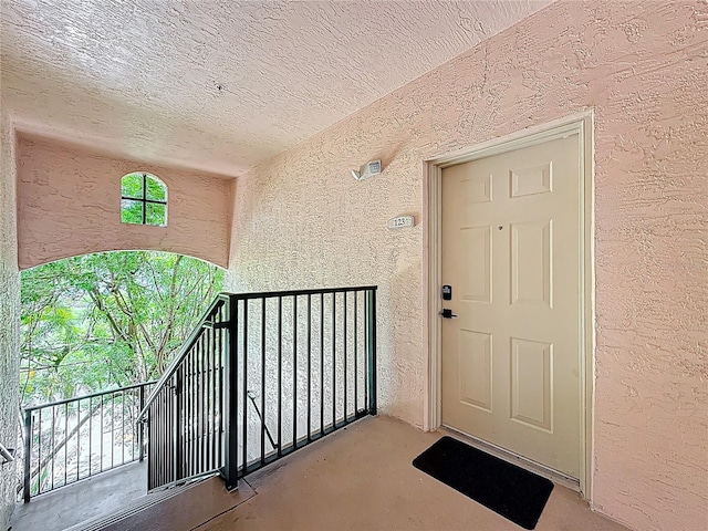 2015 SE 10th Ave Unit 123, Fort Lauderdale, FL 33316 - doorway to property featuring stucco siding and a balcony
