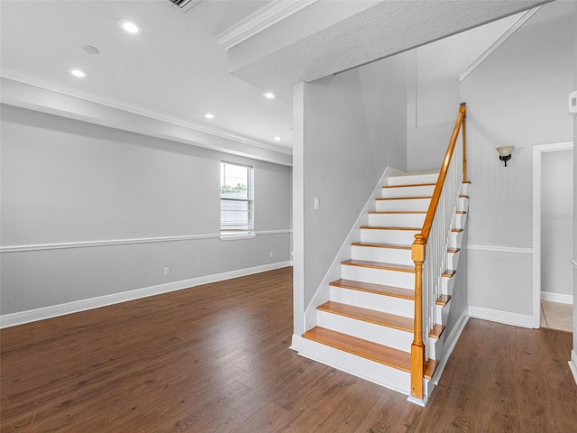 8806 Bayaud Dr, Tampa, FL 33626 - stairway with recessed lighting, crown molding, wood finished floors, and baseboards
