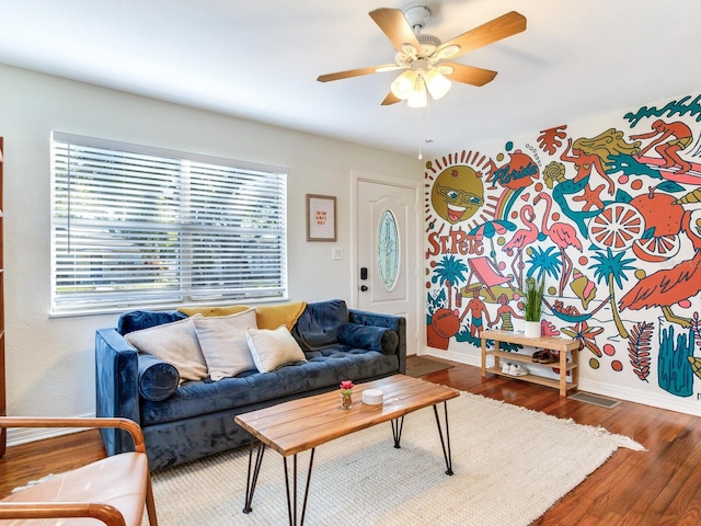 1243 55th Ave N, Saint Petersburg, FL 33703 - living room featuring a ceiling fan and wood finished floors