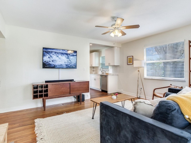 1243 55th Ave N, Saint Petersburg, FL 33703 - living room featuring ceiling fan and wood finished floors