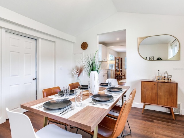 1243 55th Ave N, Saint Petersburg, FL 33703 - dining space featuring vaulted ceiling and wood finished floors