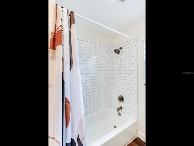 1243 55th Ave N, Saint Petersburg, FL 33703 - bathroom featuring shower / bath combination with curtain