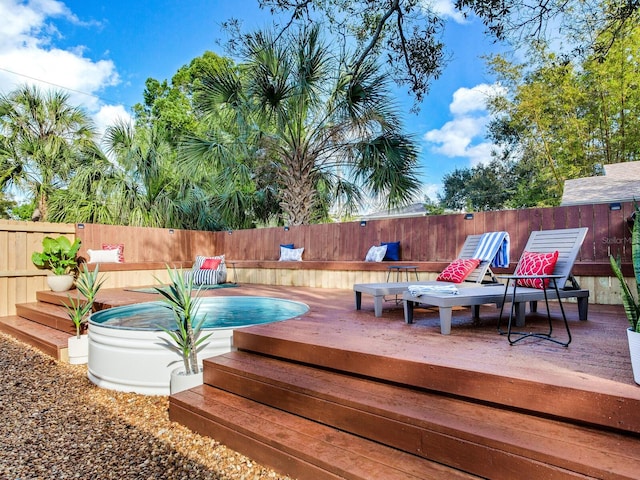 1243 55th Ave N, Saint Petersburg, FL 33703 - wooden terrace with a fenced backyard