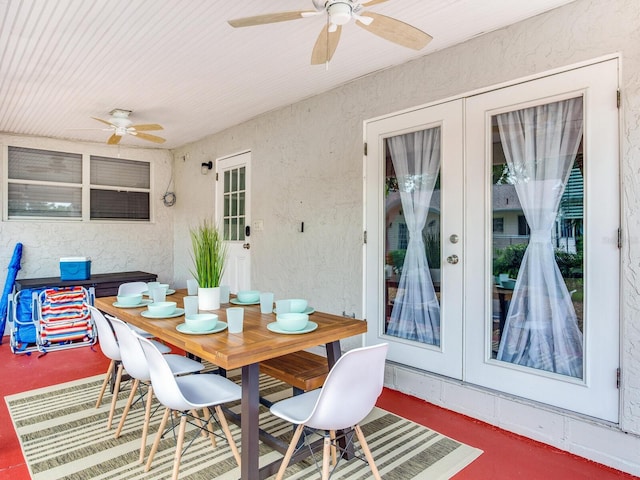 1243 55th Ave N, Saint Petersburg, FL 33703 - dining space with ceiling fan, french doors, and a textured wall
