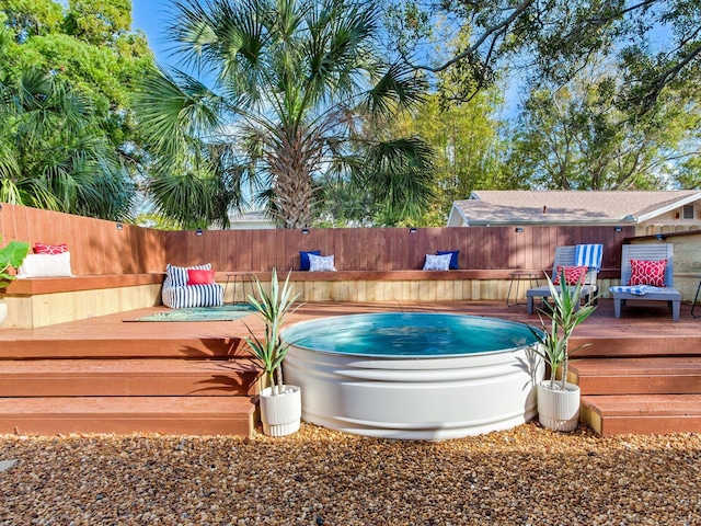 1243 55th Ave N, Saint Petersburg, FL 33703 - view of pool featuring an outdoor hot tub and a deck