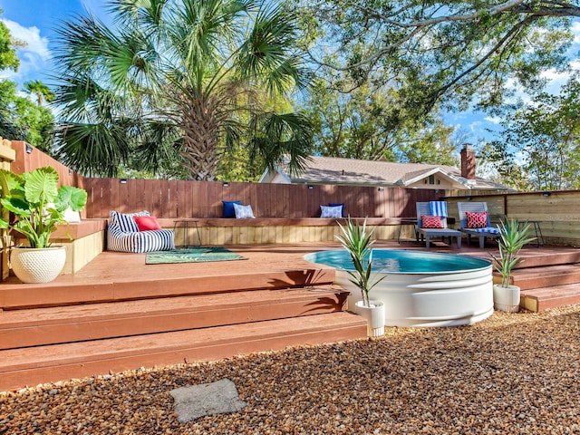 1243 55th Ave N, Saint Petersburg, FL 33703 - deck with a fenced backyard and a pool