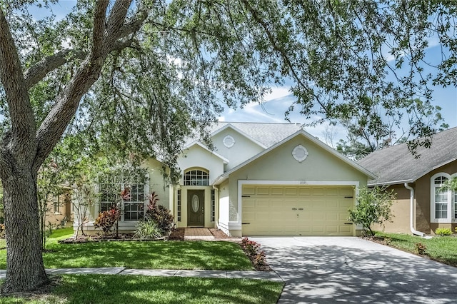 12335 Glenfield Ave, Tampa, FL 33626 - view of front facade with a garage, stucco siding, driveway, and a front lawn