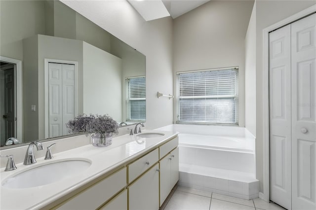 12335 Glenfield Ave, Tampa, FL 33626 - bathroom with a closet, double vanity, a bath, and tile patterned flooring