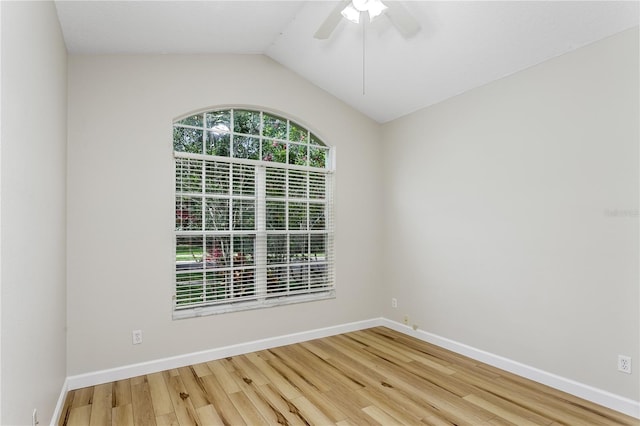 12335 Glenfield Ave, Tampa, FL 33626 - unfurnished room with wood finished floors, baseboards, vaulted ceiling, and ceiling fan
