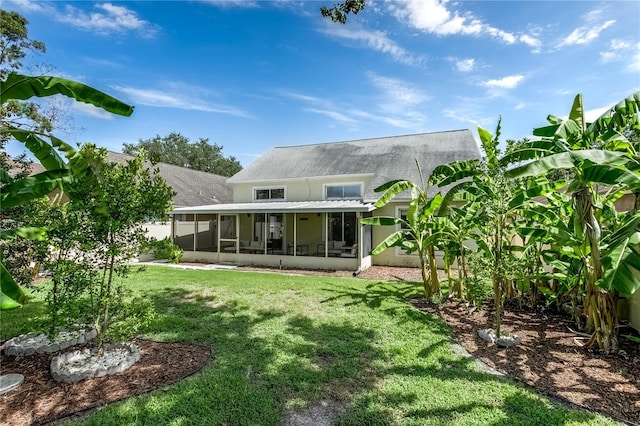 12335 Glenfield Ave, Tampa, FL 33626 - back of house with a sunroom, a lawn, and roof with shingles