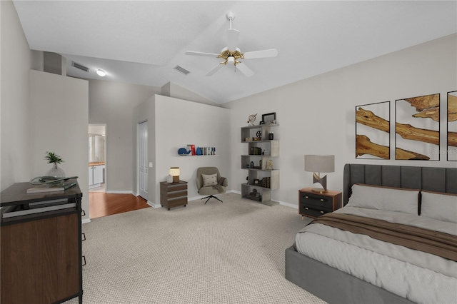12209 Glencliff Cir, Tampa, FL 33626 - bedroom with carpet floors, vaulted ceiling, connected bathroom, and ceiling fan