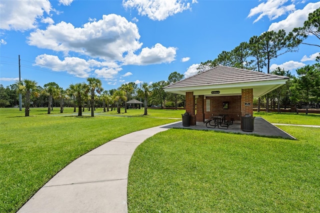 12209 Glencliff Cir, Tampa, FL 33626 - view of property's community with a lawn