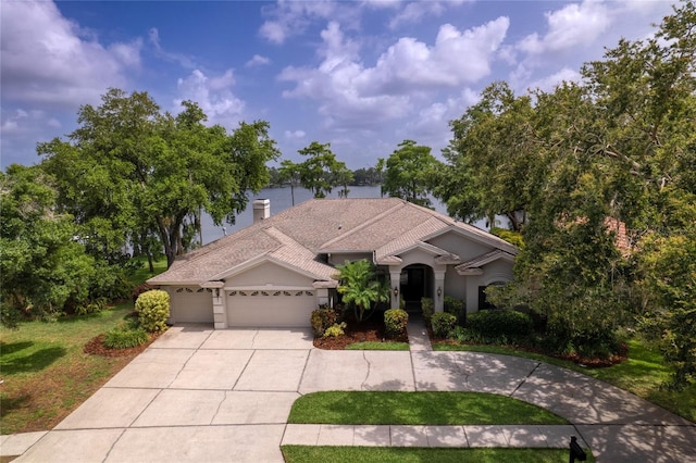 15012 Maurine Cove Ln, Odessa, FL 33556 - view of front of property with a garage, concrete driveway, a front yard, stucco siding, and a chimney