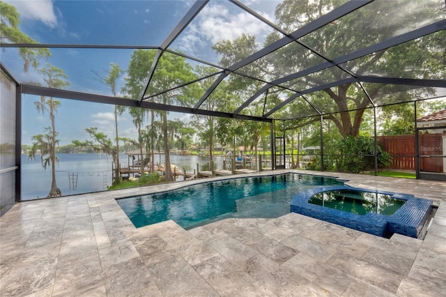15012 Maurine Cove Ln, Odessa, FL 33556 - view of pool with a water view, a patio area, a pool with connected hot tub, and a lanai