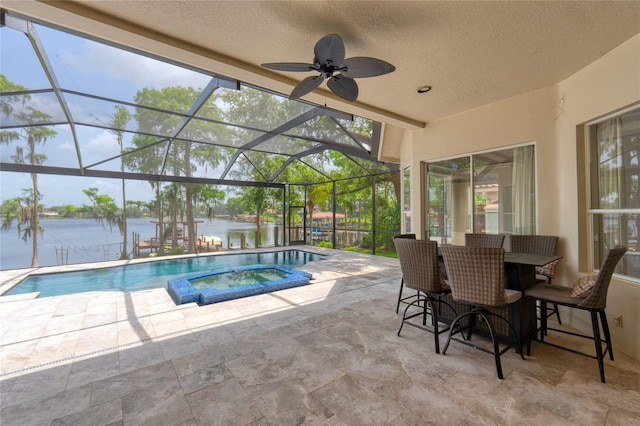 15012 Maurine Cove Ln, Odessa, FL 33556 - swimming pool with a water view, a patio, an in-ground hot tub, and a ceiling fan
