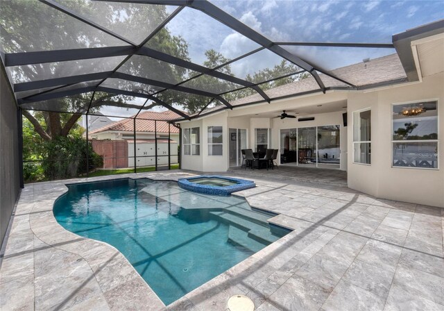 15012 Maurine Cove Ln, Odessa, FL 33556 - view of pool featuring a patio, a ceiling fan, a pool with connected hot tub, and glass enclosure