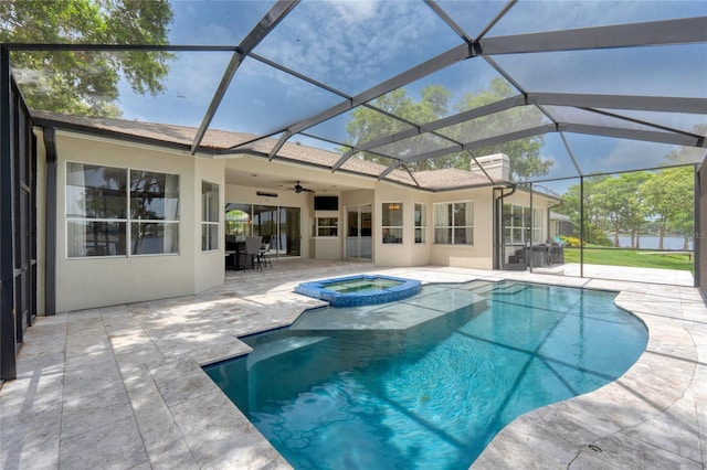 15012 Maurine Cove Ln, Odessa, FL 33556 - view of pool featuring a patio area, ceiling fan, a pool with connected hot tub, and a lanai