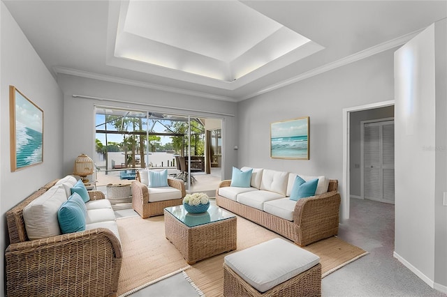 15012 Maurine Cove Ln, Odessa, FL 33556 - living room with a tray ceiling, a sunroom, light carpet, and ornamental molding
