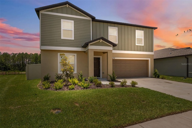 34797 Rainville Loop, Zephyrhills, FL 33541 - view of front of property with a garage, driveway, a front lawn, board and batten siding, and stucco siding