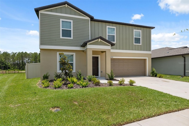 34797 Rainville Loop, Zephyrhills, FL 33541 - view of front of home with board and batten siding, driveway, an attached garage, and a front lawn
