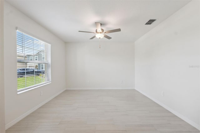 34797 Rainville Loop, Zephyrhills, FL 33541 - empty room with a ceiling fan and baseboards