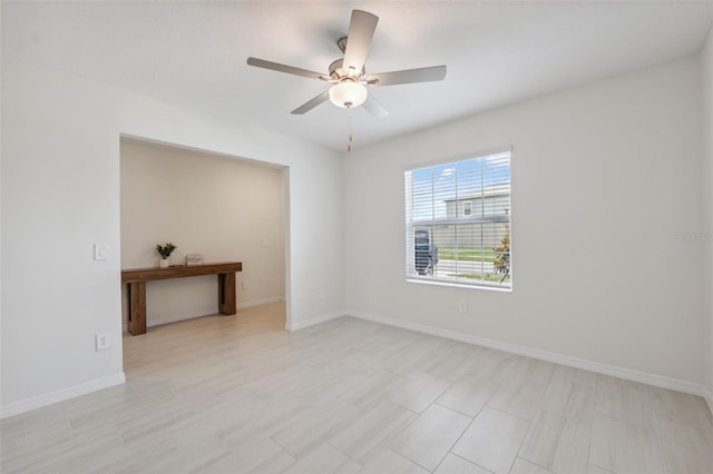 34797 Rainville Loop, Zephyrhills, FL 33541 - empty room with ceiling fan and baseboards