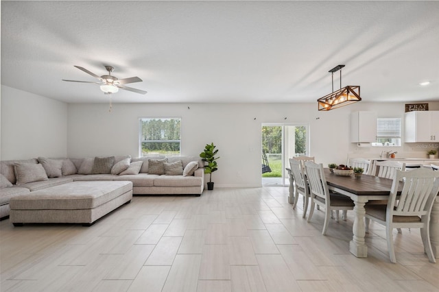 34797 Rainville Loop, Zephyrhills, FL 33541 - living area featuring ceiling fan and baseboards