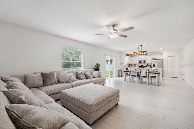 34797 Rainville Loop, Zephyrhills, FL 33541 - living room with ceiling fan