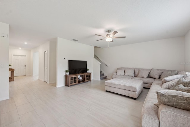 34797 Rainville Loop, Zephyrhills, FL 33541 - living area with ceiling fan, stairs, baseboards, and recessed lighting