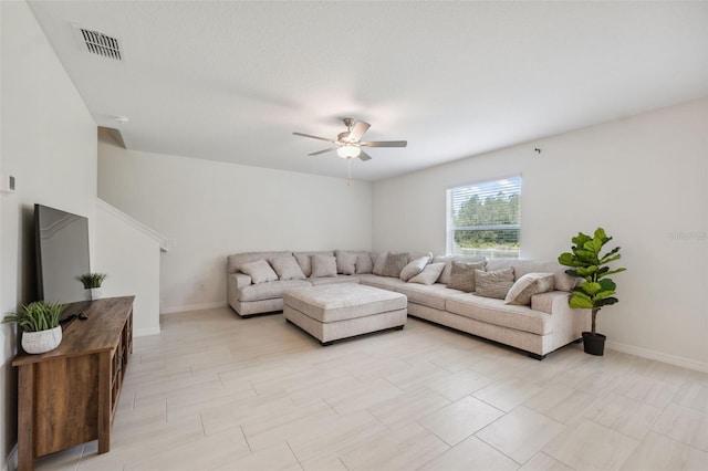 34797 Rainville Loop, Zephyrhills, FL 33541 - living room with a ceiling fan and baseboards