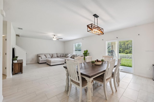 34797 Rainville Loop, Zephyrhills, FL 33541 - dining area with ceiling fan and baseboards