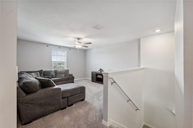 34797 Rainville Loop, Zephyrhills, FL 33541 - living room with light colored carpet, ceiling fan, and baseboards