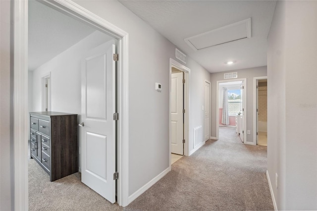 34797 Rainville Loop, Zephyrhills, FL 33541 - hallway featuring light carpet and baseboards