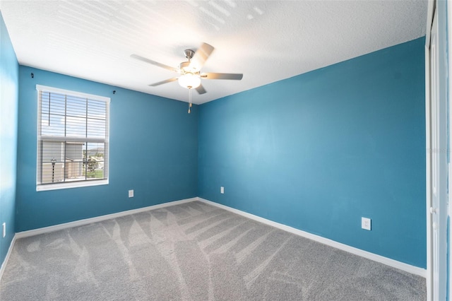 34797 Rainville Loop, Zephyrhills, FL 33541 - spare room with carpet, ceiling fan, baseboards, and a textured ceiling