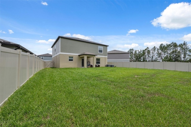 34797 Rainville Loop, Zephyrhills, FL 33541 - rear view of property featuring central air condition unit