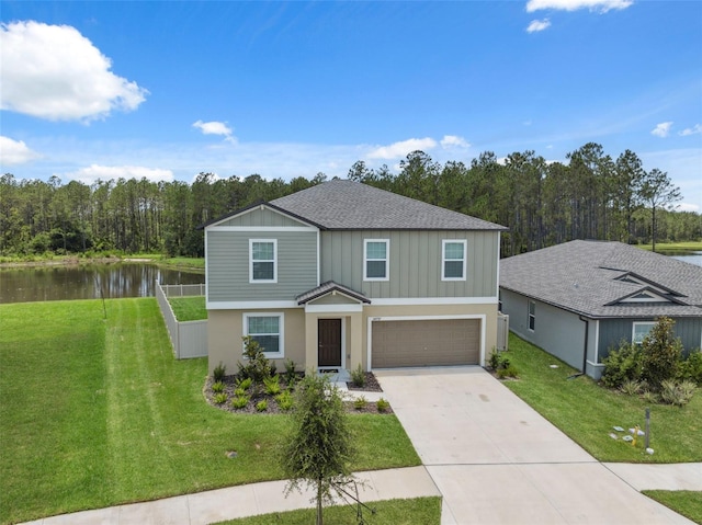 34797 Rainville Loop, Zephyrhills, FL 33541 - traditional home with a water view, a garage, concrete driveway, and a front yard