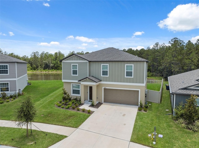 34797 Rainville Loop, Zephyrhills, FL 33541 - traditional-style home with board and batten siding, concrete driveway, a garage, and a water view