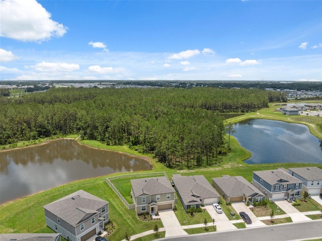 34797 Rainville Loop, Zephyrhills, FL 33541 - aerial perspective of suburban area featuring a nearby body of water and a forest