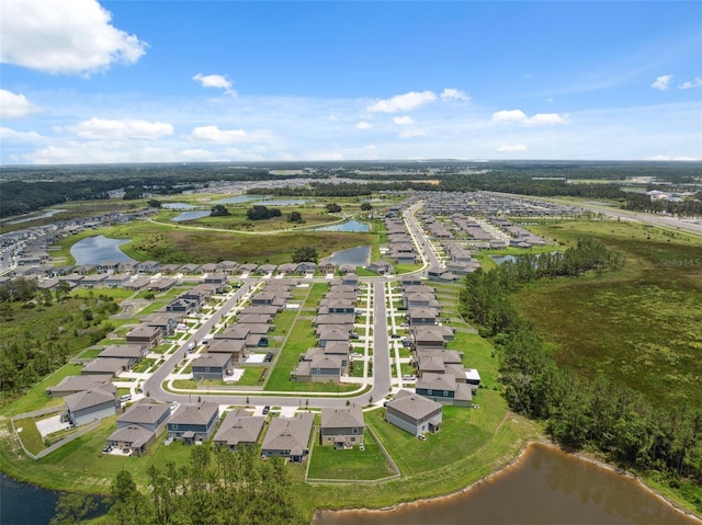 34797 Rainville Loop, Zephyrhills, FL 33541 - aerial view of property and surrounding area featuring nearby suburban area and a large body of water