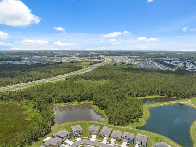 34797 Rainville Loop, Zephyrhills, FL 33541 - drone / aerial view of a large body of water and a heavily wooded area