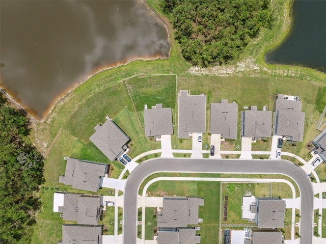 34797 Rainville Loop, Zephyrhills, FL 33541 - aerial view of property and surrounding area with a large body of water and nearby suburban area