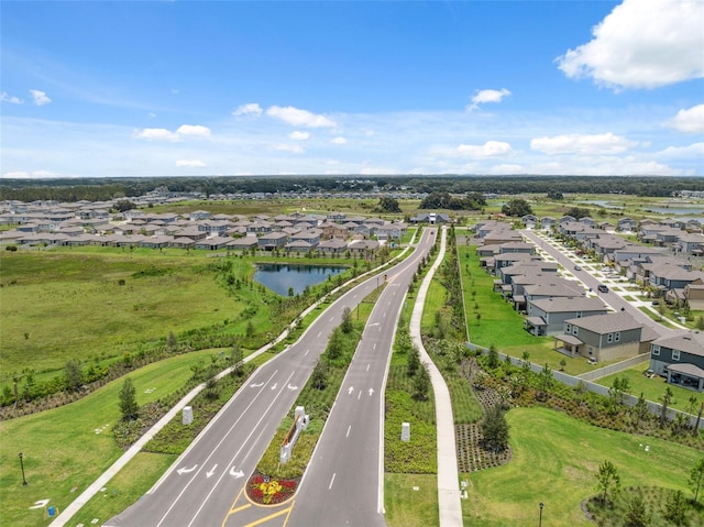 34797 Rainville Loop, Zephyrhills, FL 33541 - aerial perspective of suburban area featuring a large body of water