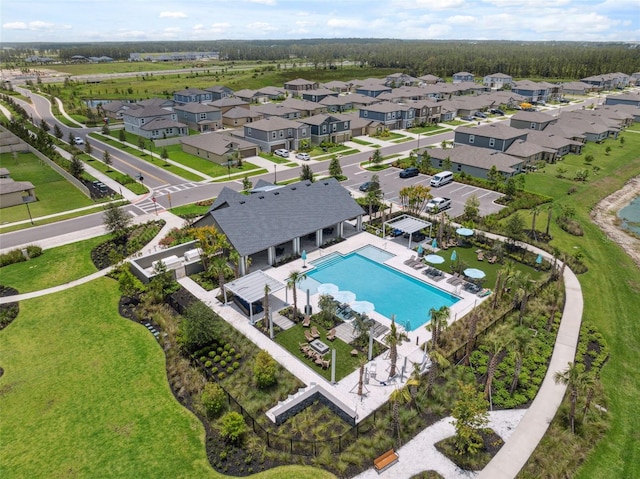 34797 Rainville Loop, Zephyrhills, FL 33541 - aerial view of residential area featuring a pool area