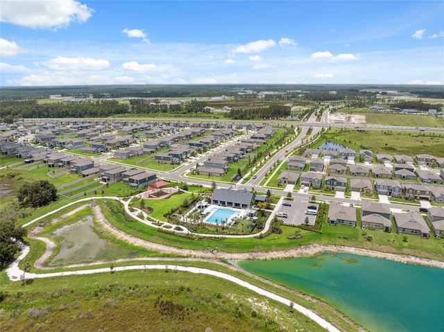 34797 Rainville Loop, Zephyrhills, FL 33541 - aerial view of residential area featuring a large body of water and a pool