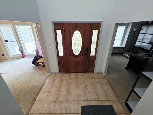 2975 E Withlacoochee Trl, Dunnellon, FL 34434 - entrance foyer with light carpet, light tile patterned floors, and a towering ceiling